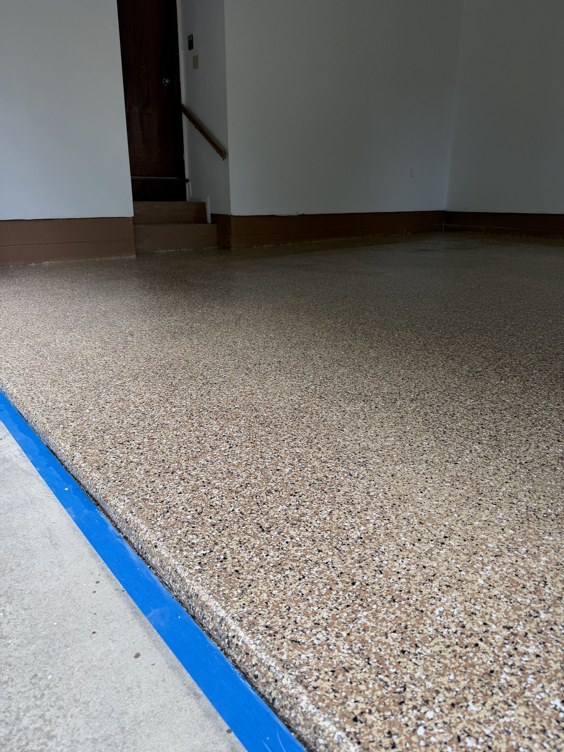 A finished flake epoxy garage floor installed by Luxury Epoxy Floors NJ